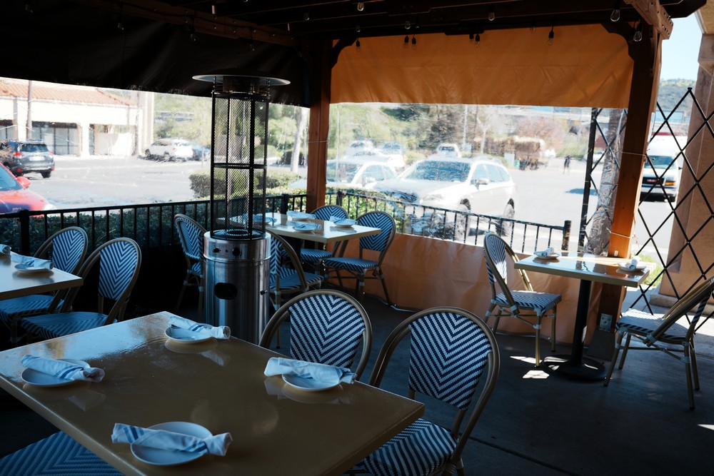 Covered patio seating at Amuri Italian Cuisine